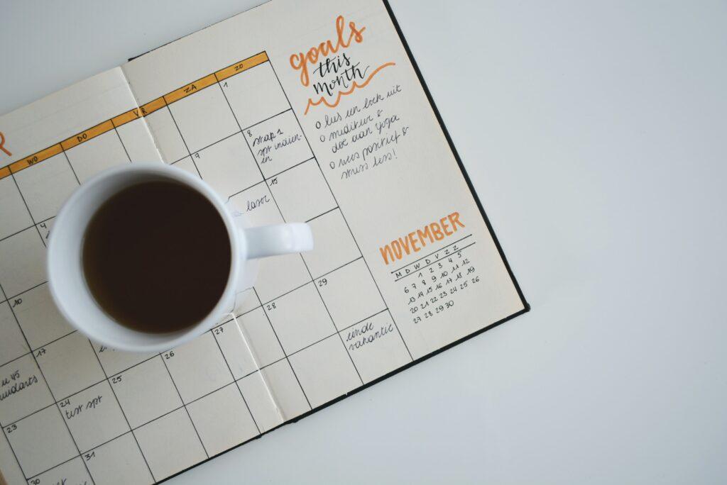 calendar and a mug of coffee