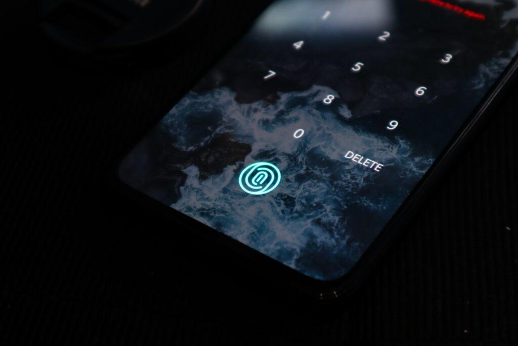 a mobile device with a locked screen and a finger print authentication