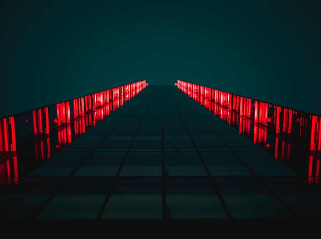 An red-light illuminated building in the dark